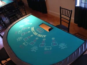 A table with cards and chairs in front of it.