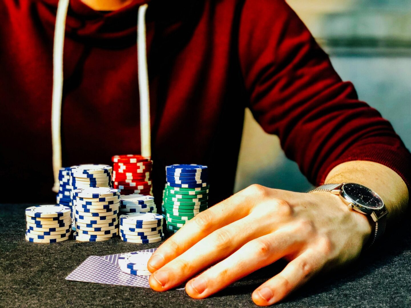 A person playing poker with chips on the table