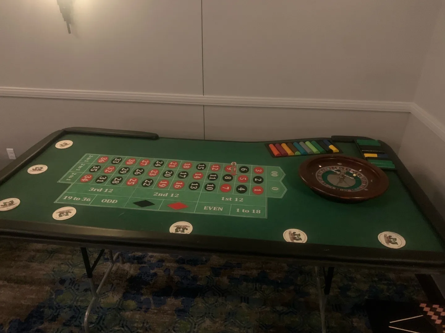 A table with roulette and chips on it.