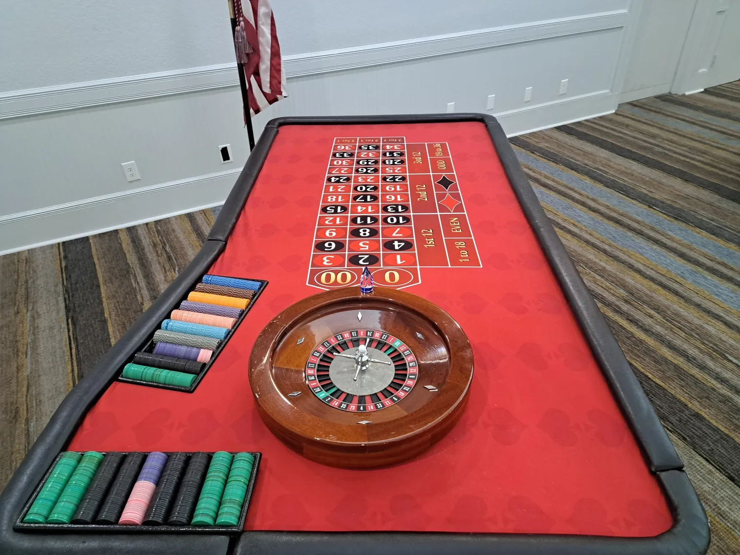 A roulette table with the wheel on it